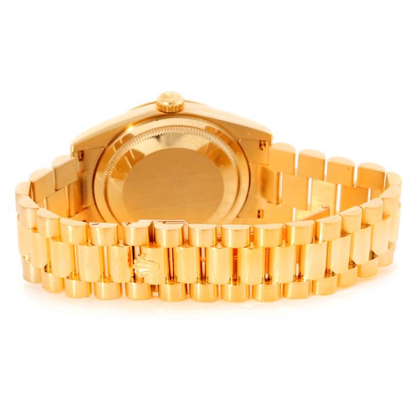 The image shows the backside and bracelet of a Rolex President 118238 Men
s Yellow Gold White Dial 118238 Men
s Yellow Gold White Dial model watch in gold.