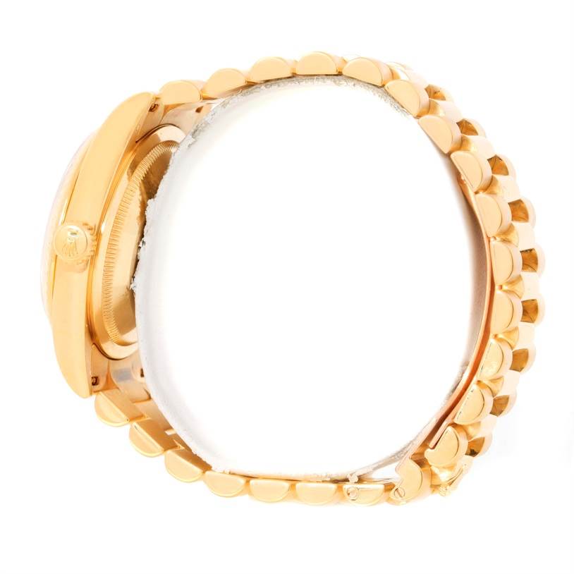 The Rolex President 118238 Men
s Yellow Gold White Dial 118238 Men
s Yellow Gold White Dial model watch is shown from the side angle, highlighting the crown, case, and part of the bracelet.