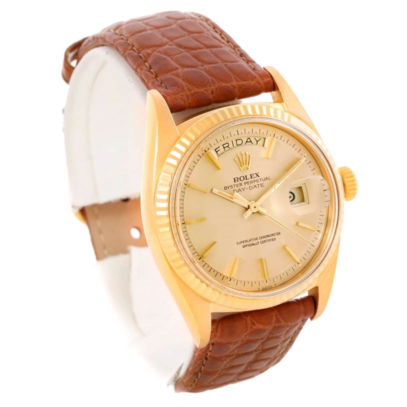 The image shows a Rolex President 1803 Men
s Yellow Gold Champagne Dial 1803 Men
s Yellow Gold Champagne Dial model watch from a slight side angle, highlighting its face, bezel, crown, and leather strap.