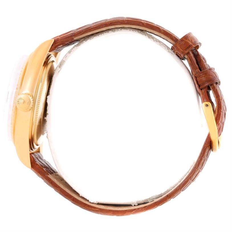 The Rolex President 1803 Men
s Yellow Gold Champagne Dial 1803 Men
s Yellow Gold Champagne Dial model watch is shown here from a side angle, highlighting its gold case, crown, and brown leather strap.