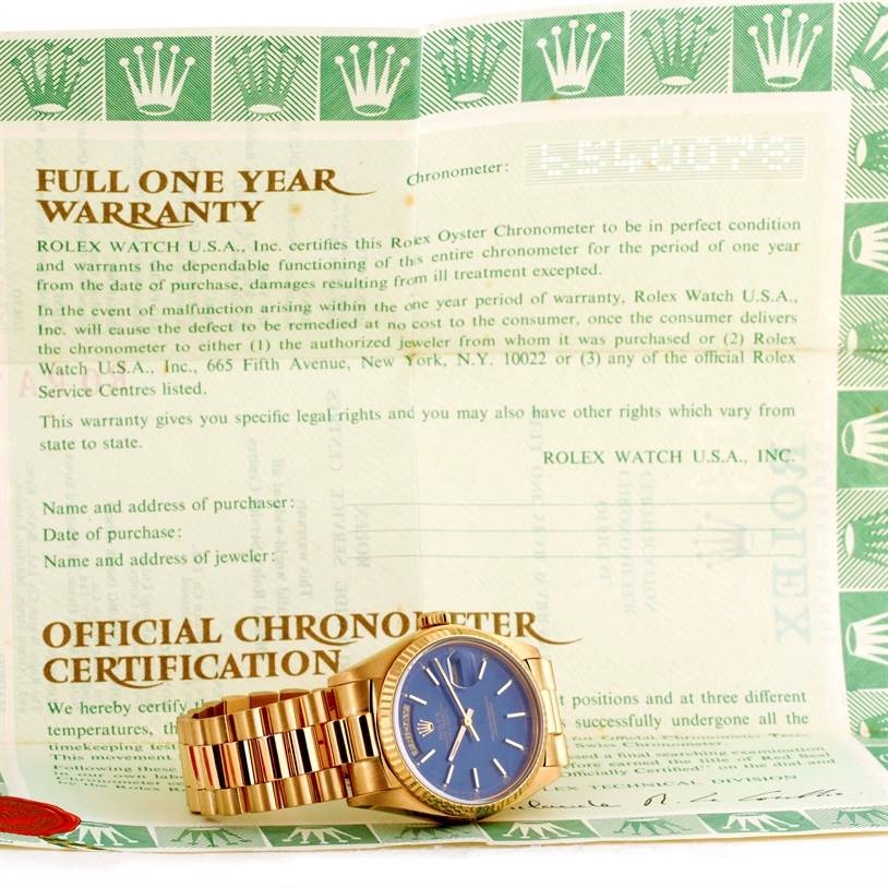 The image shows a Rolex President 18038 Men's Yellow Gold Blue Dial 18038 Men's Yellow Gold Blue Dial model watch with a blue dial, positioned on an official chronometer certification and warranty document.