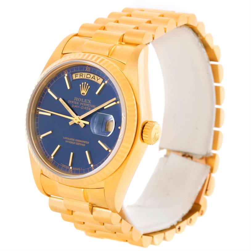 This Rolex President 18038 Men's Yellow Gold Blue Dial 18038 Men's Yellow Gold Blue Dial model watch is shown at an angle displaying the blue dial, day-date feature, bezel, and gold bracelet.
