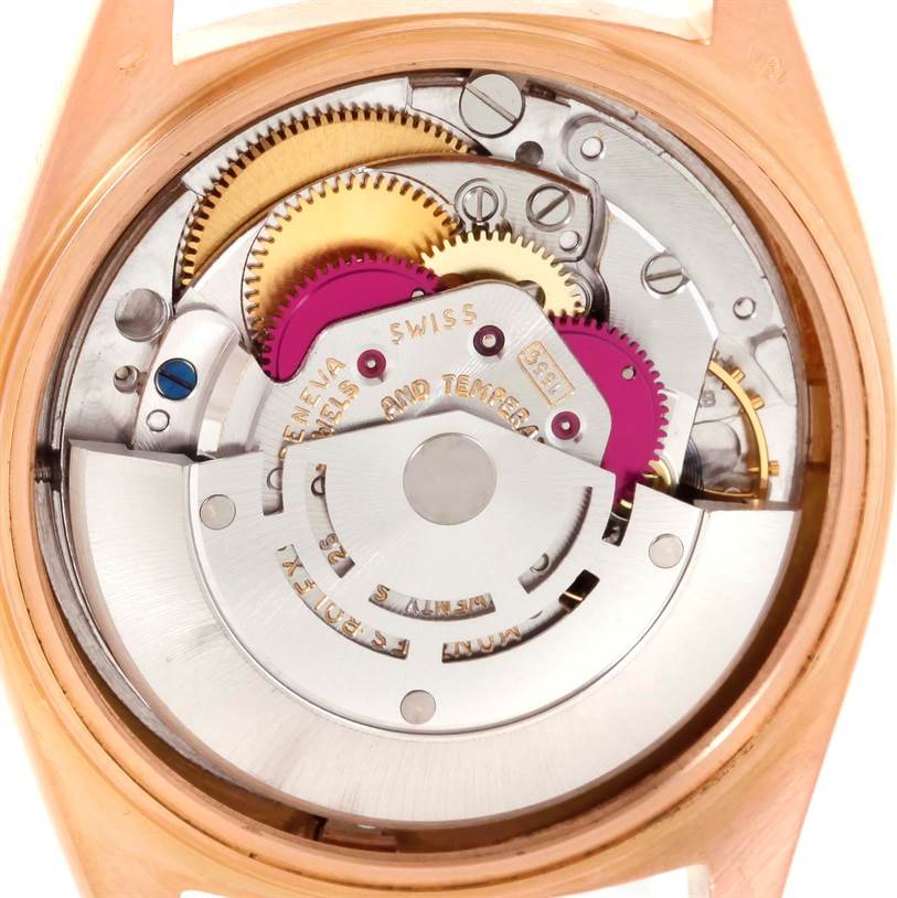 This is a close-up view of the internal mechanisms of a Rolex President 1803 Men's Rose Gold Pink Dial 1803 Men's Rose Gold Pink Dial model watch, showing gears and other mechanical parts.