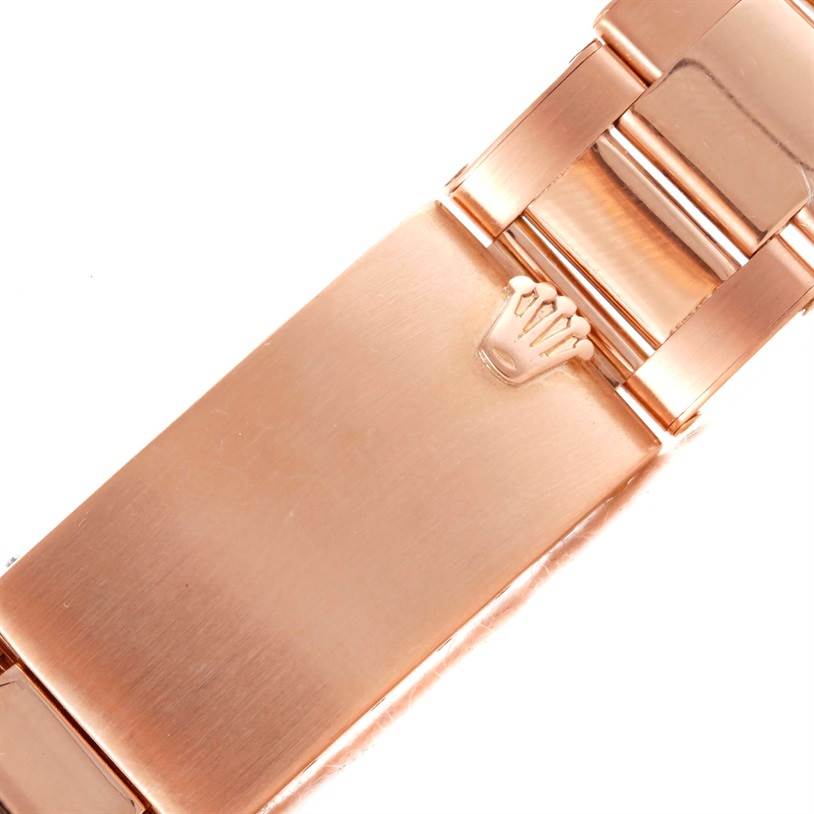 This image shows a close-up of the clasp and part of the bracelet of a Rolex President 1803 Men's Rose Gold Pink Dial 1803 Men's Rose Gold Pink Dial model.