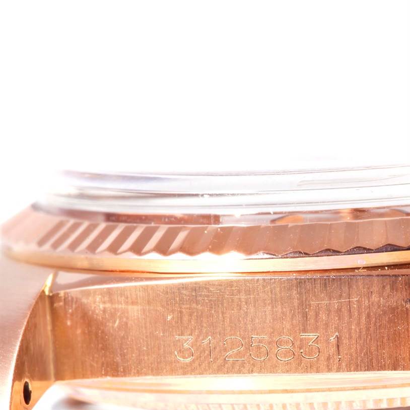 The image shows a side angle of the Rolex President 1803 Men's Rose Gold Pink Dial 1803 Men's Rose Gold Pink Dial watch, focusing on the serial number and bezel.