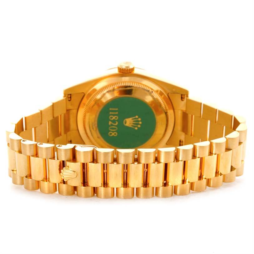 The image shows the back case and the bracelet of a Rolex President 118208 Men's Yellow Gold Black Dial 118208 Men's Yellow Gold Black Dial model watch, displaying the case back and clasp.