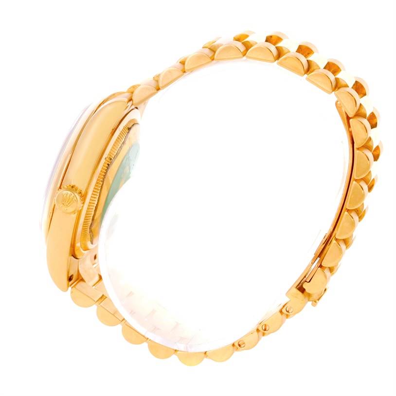 The image shows a side view of the Rolex President 118208 Men's Yellow Gold Black Dial 118208 Men's Yellow Gold Black Dial model watch, highlighting the crown and part of the bracelet.