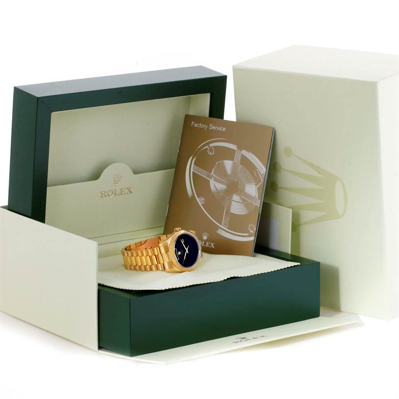 The image shows a Rolex President 118208 Men's Yellow Gold Black Dial 118208 Men's Yellow Gold Black Dial model watch in its open box, along with a factory service booklet and outer packaging.