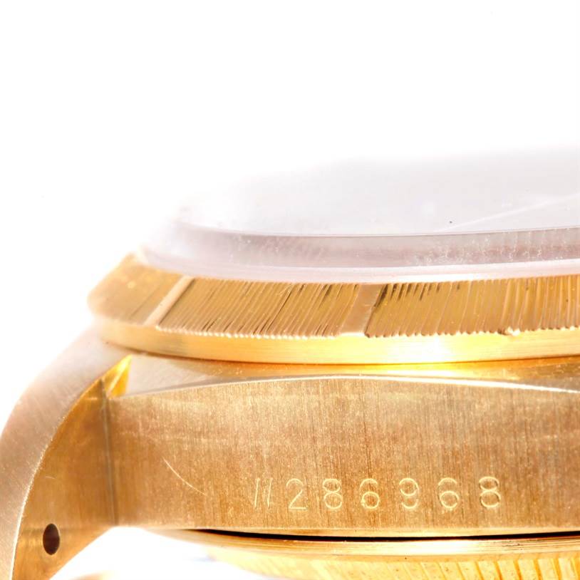 This image shows a close-up of the case and bezel of a Rolex President 18248 Men
s Yellow Gold Champagne Dial 18248 Men
s Yellow Gold Champagne Dial model watch from a side angle.
