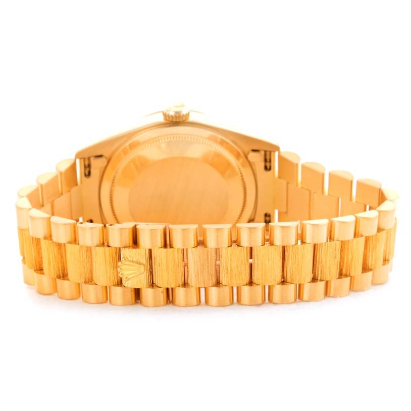 This image shows the back case and bracelet of a gold Rolex President 18248 Men
s Yellow Gold Champagne Dial 18248 Men
s Yellow Gold Champagne Dial model watch, viewed from the rear.