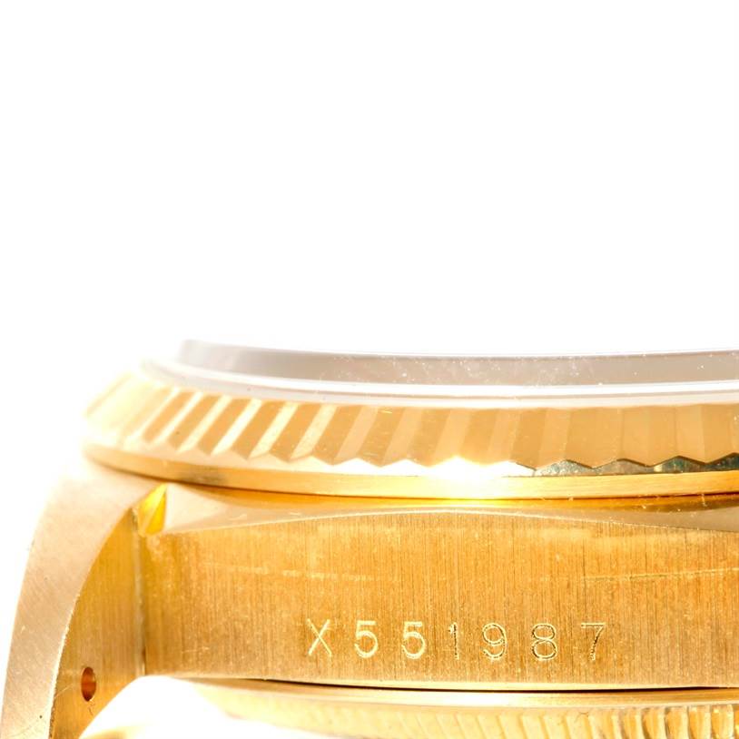 This image shows a close-up of the side, bezel, and serial number of a Rolex President 18238 Men
s Yellow Gold Champagne Dial 18238 Men
s Yellow Gold Champagne Dial model watch.