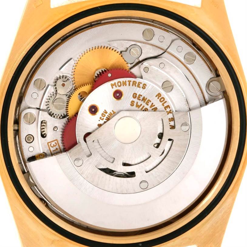 This image shows a close-up view of the internal mechanical movement of a Rolex President 18238 Men
s Yellow Gold Champagne Dial 18238 Men
s Yellow Gold Champagne Dial model watch.