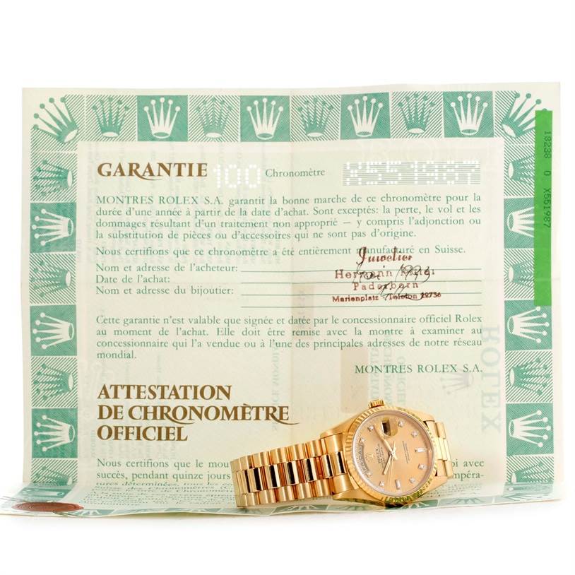 The Rolex President 18238 Men
s Yellow Gold Champagne Dial 18238 Men
s Yellow Gold Champagne Dial model watch is shown face-up with the guarantee document in the background.