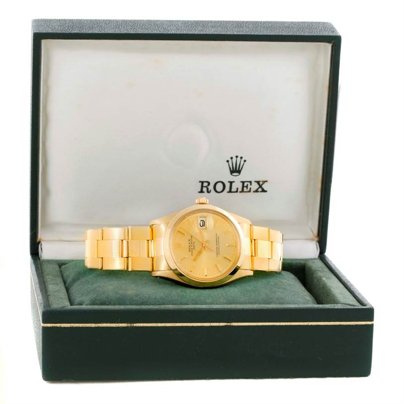 The image shows a Rolex President 1500 Men
s Yellow Gold Champagne Dial 1500 Men
s Yellow Gold Champagne Dial model watch from a front angle, placed inside its branded box.