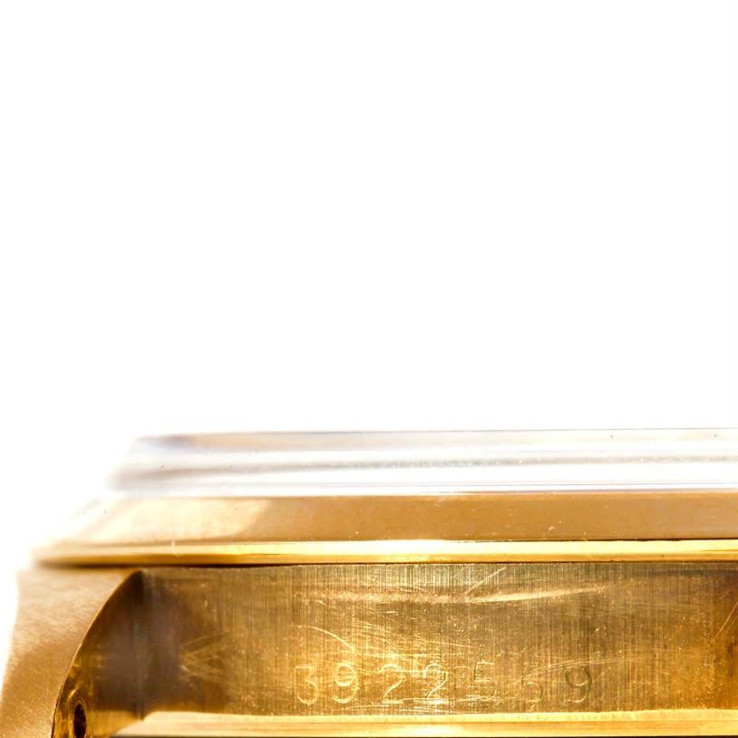 This image shows a close-up of the side of the case of the Rolex President 1500 Men
s Yellow Gold Champagne Dial 1500 Men
s Yellow Gold Champagne Dial model watch, focusing on the serial number.