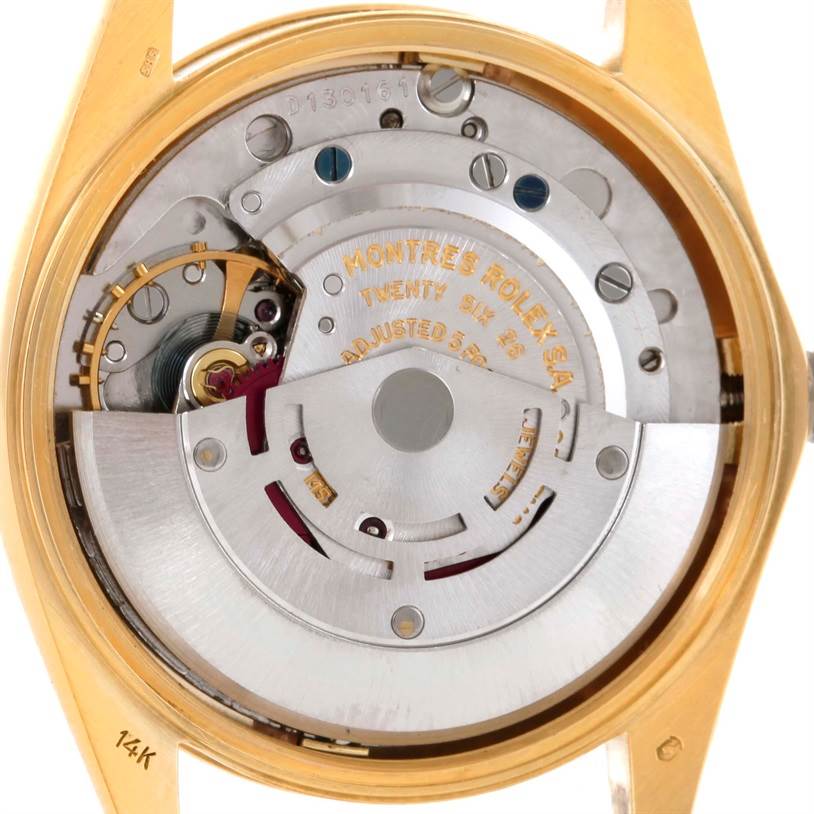 The image shows the movement and internal mechanism of a Rolex President 1500 Men
s Yellow Gold Champagne Dial 1500 Men
s Yellow Gold Champagne Dial model watch from a rear angle.
