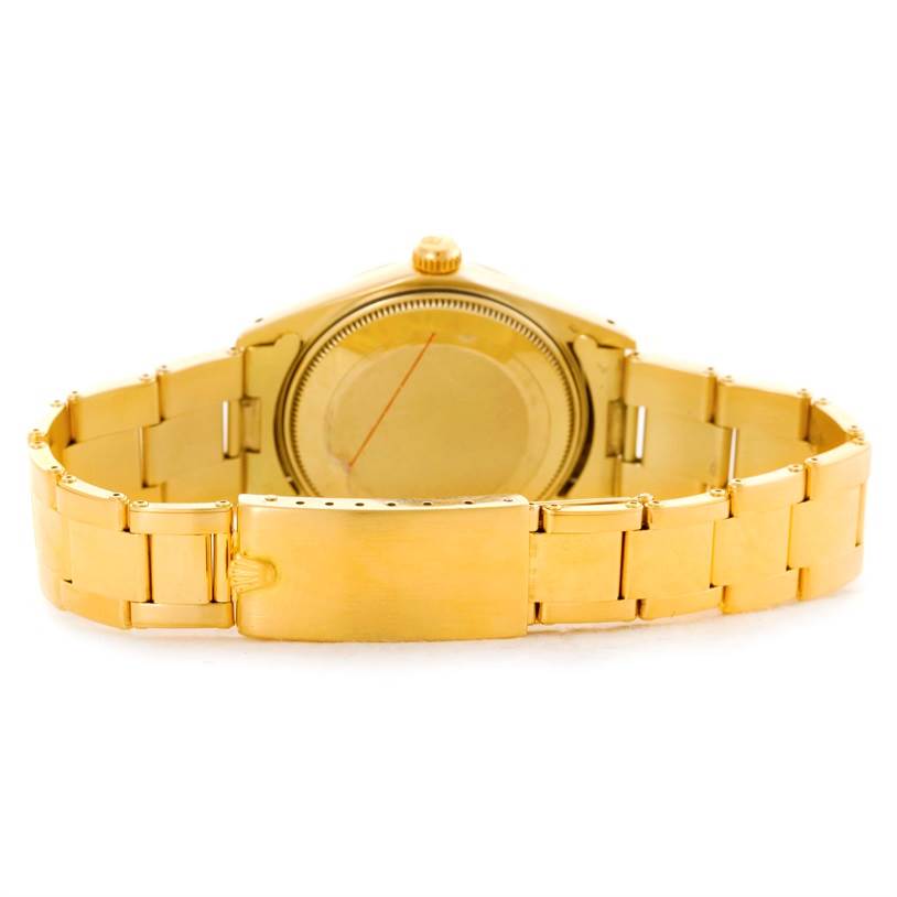 The image shows the backside, case back, and bracelet clasp of a Rolex President 1500 Men
s Yellow Gold Champagne Dial 1500 Men
s Yellow Gold Champagne Dial model watch in gold.