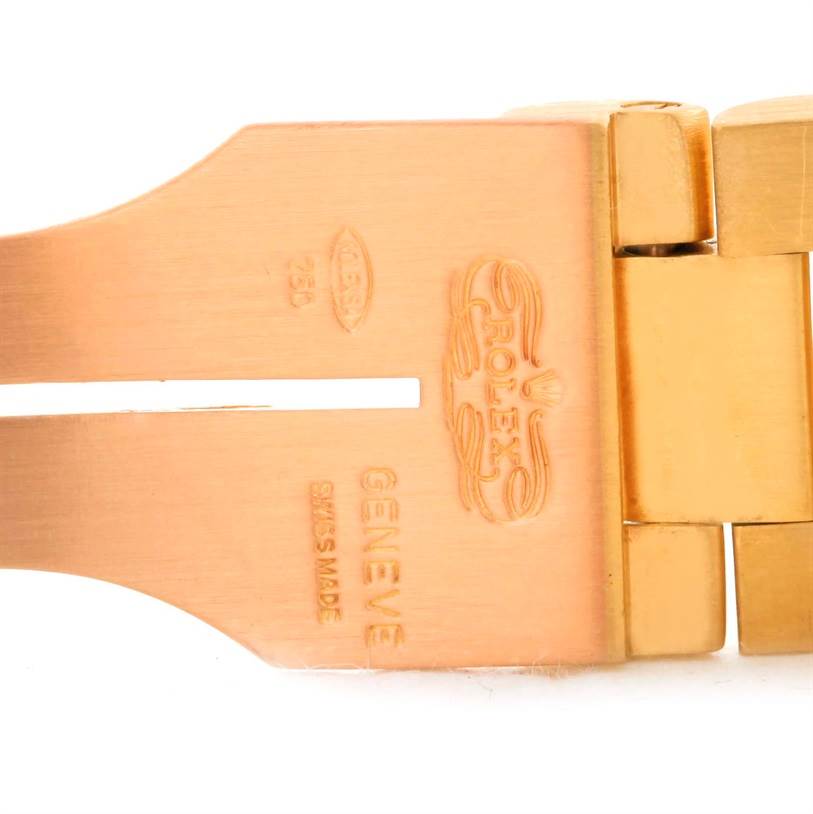 The image shows a close-up of the clasp on a Rolex President 1803 Men's  1803 Men's  model watch, detailing the engravings and gold material.