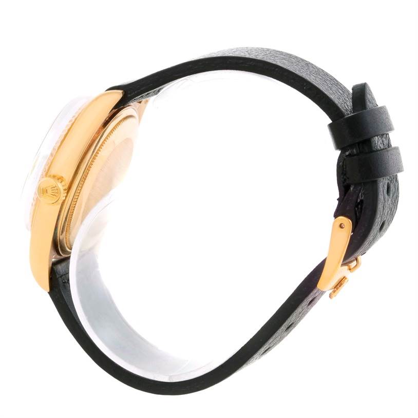 The image shows a side profile of a Rolex President 1803 Men
s Yellow Gold Champagne Dial 1803 Men
s Yellow Gold Champagne Dial model watch, highlighting the gold case and black leather strap.