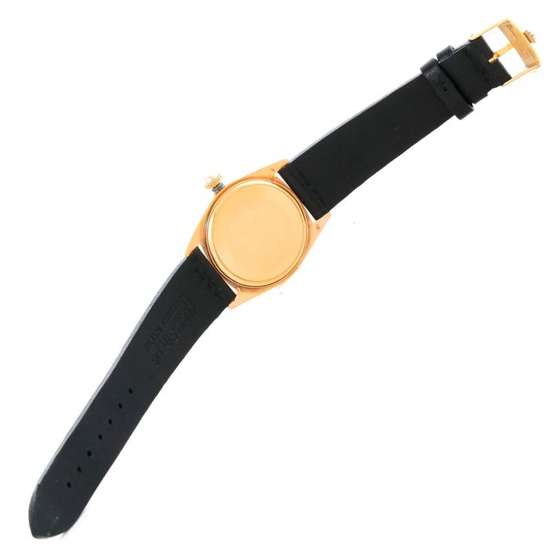 This image shows the back and the strap of a Rolex President 1803 Men
s Yellow Gold Champagne Dial 1803 Men
s Yellow Gold Champagne Dial model watch, viewed from above.