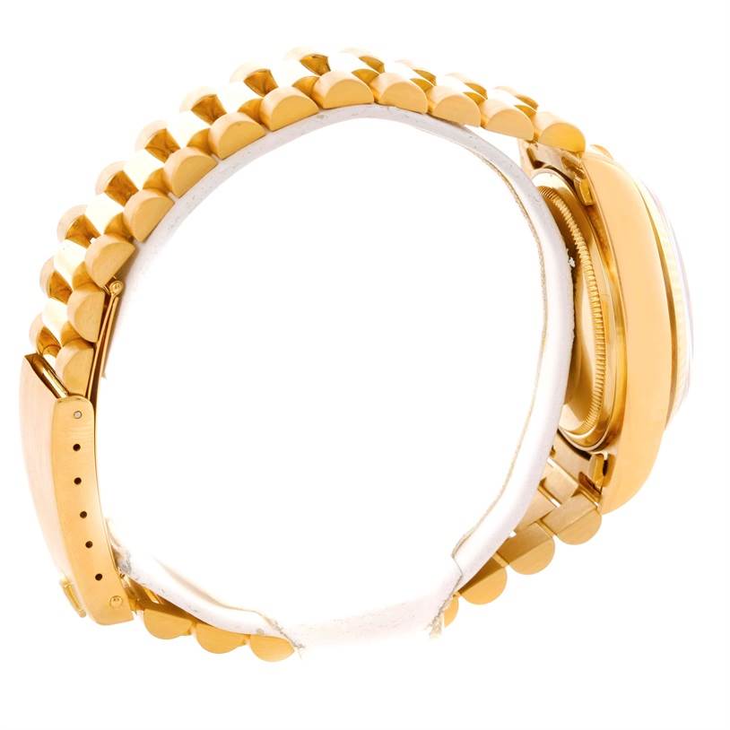 The side view of the Rolex President 18038 Men
s Yellow Gold Champagne Dial 18038 Men
s Yellow Gold Champagne Dial watch shows its gold band and clasp.