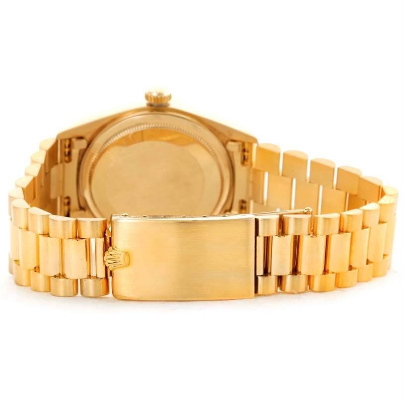 The image shows the backside of the Rolex President 18038 Men
s Yellow Gold Champagne Dial 18038 Men
s Yellow Gold Champagne Dial model watch, focusing on the clasp and bracelet links.
