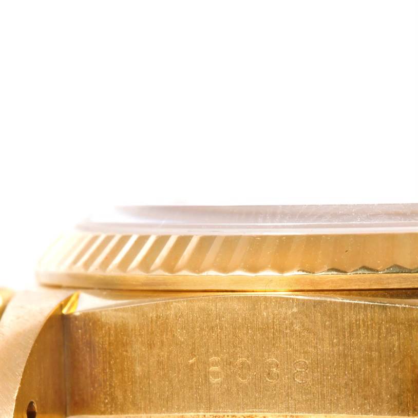 This image shows a close-up side view of the case and serial number of the Rolex President 18038 Men
s Yellow Gold Champagne Dial 18038 Men
s Yellow Gold Champagne Dial model watch.