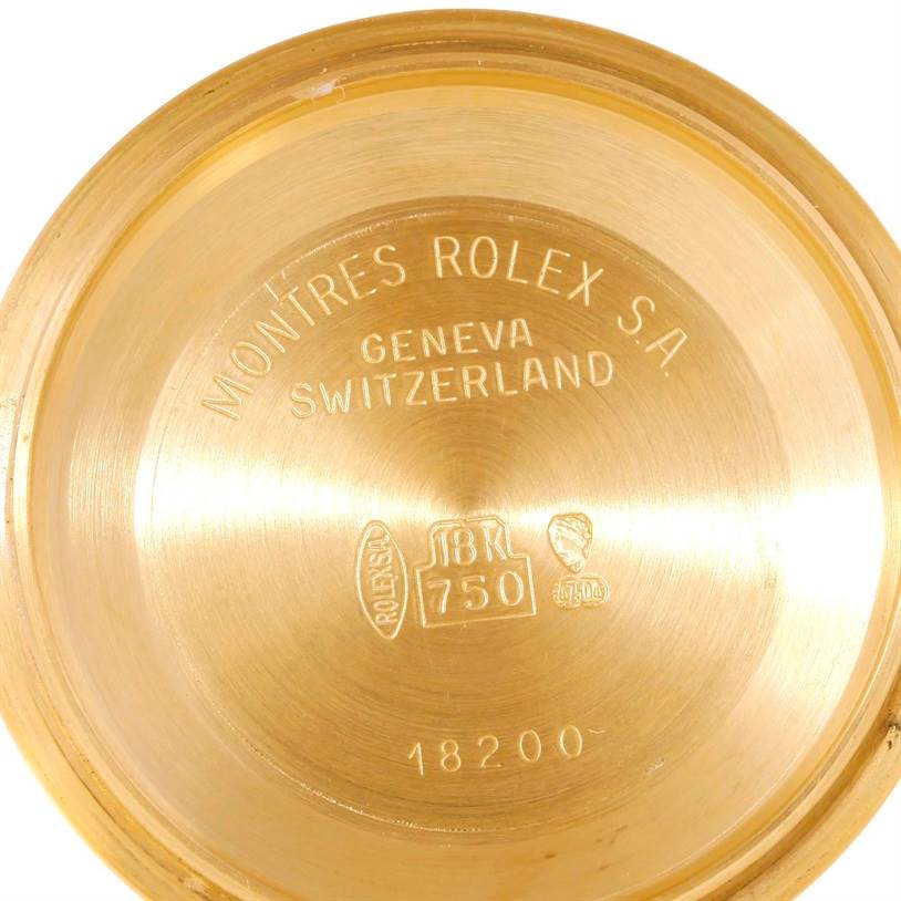 This image shows the interior of the case back for a Rolex President 18238 Men's Yellow Gold Beige Dial 18238 Men's Yellow Gold Beige Dial watch, displaying hallmark stamps and engraved information.