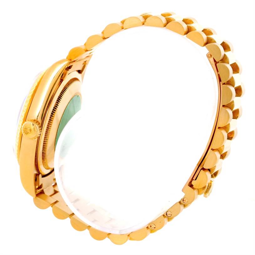 This image shows a side angle of the Rolex President 18238 Men's Yellow Gold Beige Dial 18238 Men's Yellow Gold Beige Dial watch, highlighting its gold bracelet and case.