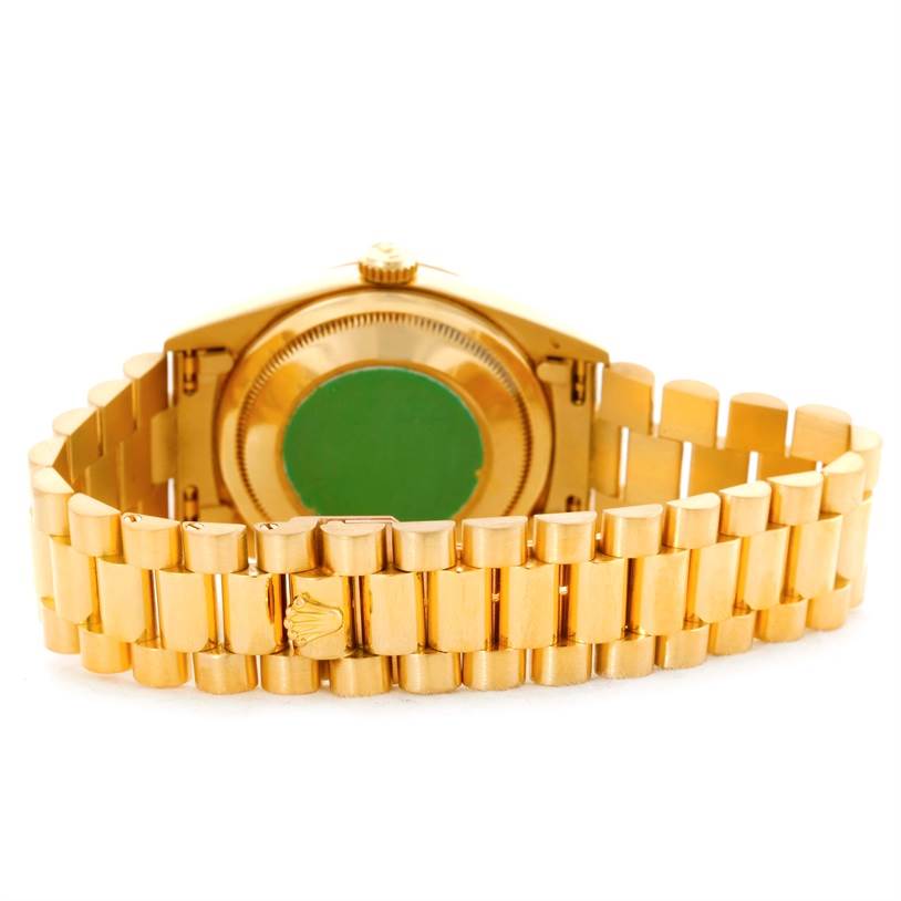 This image shows the back view of the Rolex President 18238 Men's Yellow Gold Beige Dial 18238 Men's Yellow Gold Beige Dial model, highlighting the case back and the bracelet.