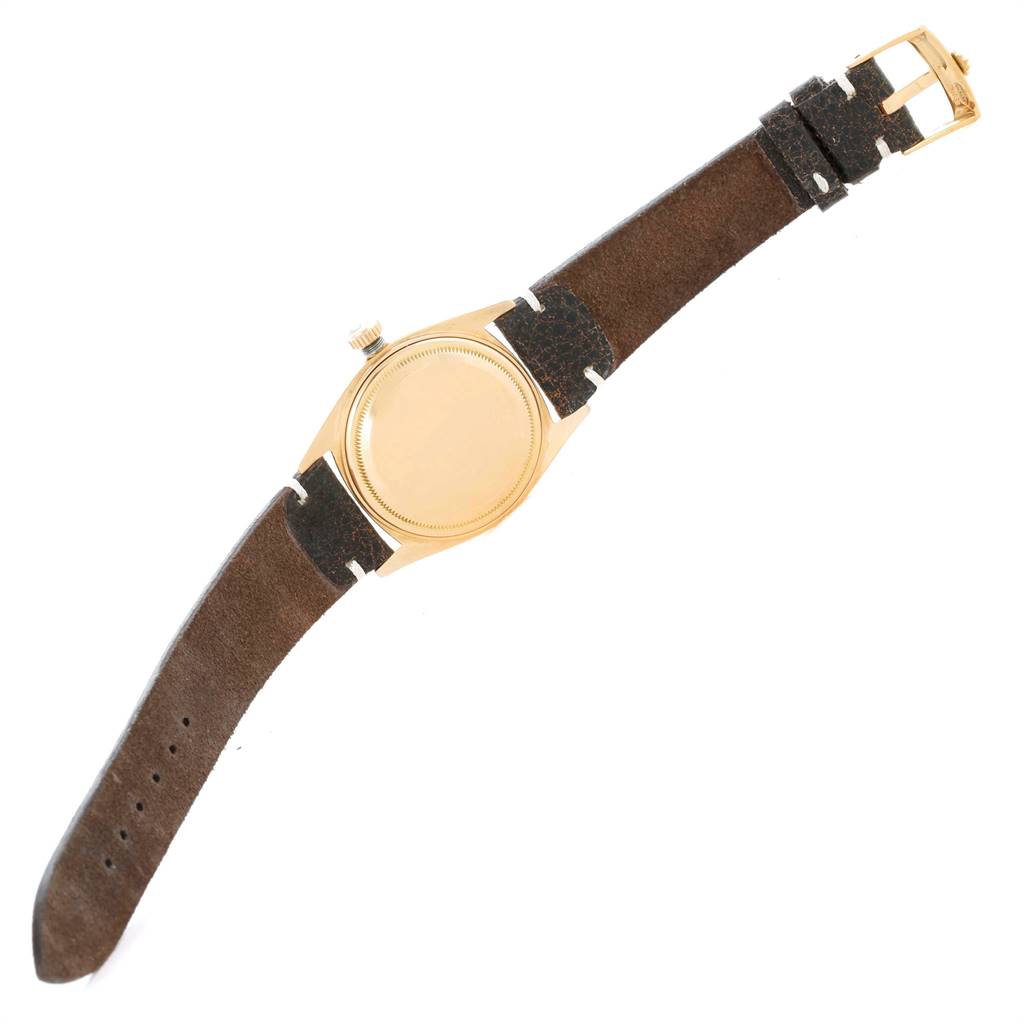 The image shows the back, bezel, crown, and strap of a Rolex President 6611 Men's Yellow Gold Champagne Dial 6611 Men's Yellow Gold Champagne Dial model watch from a top-down angle.