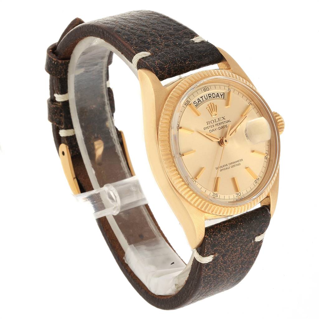 The image shows a side angle of a Rolex President 6611 Men's Yellow Gold Champagne Dial 6611 Men's Yellow Gold Champagne Dial watch, featuring its face, bezel, crown, and leather strap.