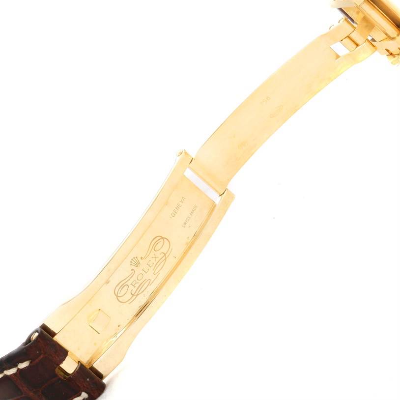 This image shows the opened clasp and part of the strap of a Rolex President 116138 Men's Yellow Gold White Dial 116138 Men's Yellow Gold White Dial model watch.