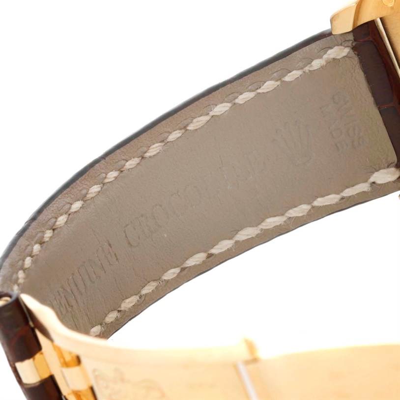 This image shows the inner side of a Rolex President 116138 Men's Yellow Gold White Dial 116138 Men's Yellow Gold White Dial model watch band with stitching and part of the clasp.