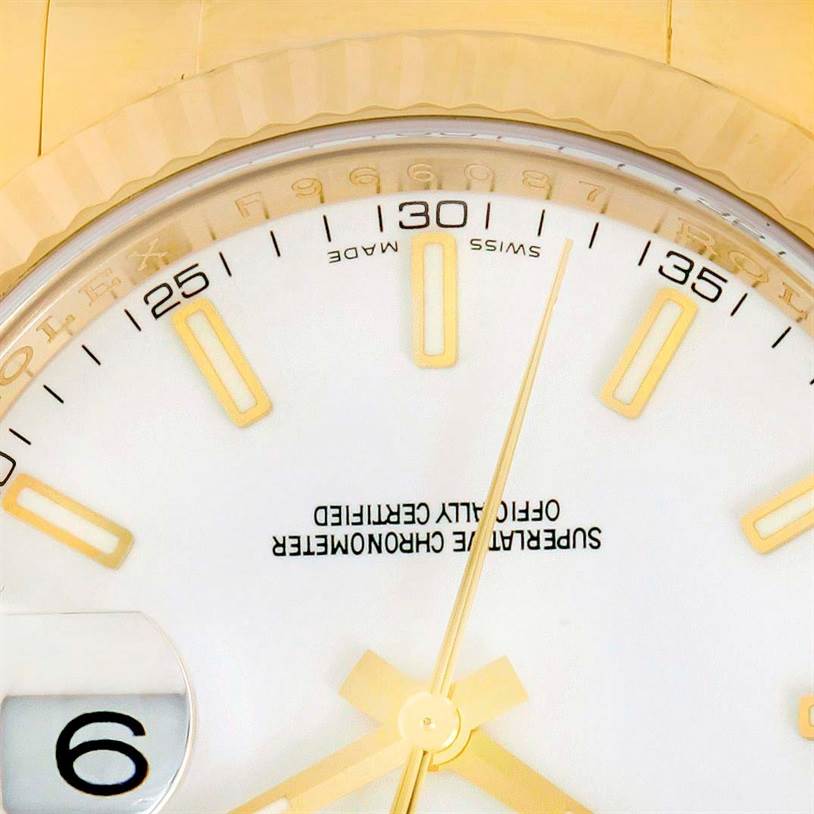 Close-up of the dial on a Rolex President 116138 Men's Yellow Gold White Dial 116138 Men's Yellow Gold White Dial model watch, showing the hands, date window, and some hour markers.