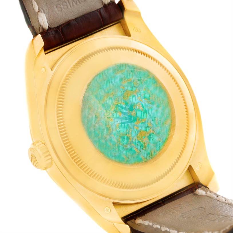 This image shows the case back and part of the strap of a Rolex President 116138 Men's Yellow Gold White Dial 116138 Men's Yellow Gold White Dial model watch.