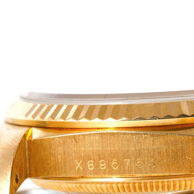 This image shows a close-up, side view of the case and bezel of a Rolex President 18238 Men
s Yellow Gold Champagne Dial 18238 Men
s Yellow Gold Champagne Dial model watch.