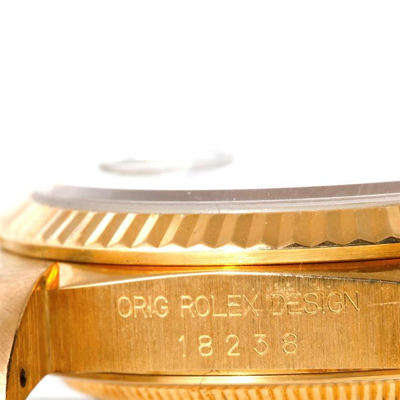 The image shows a close-up side view of the bezel and case of a Rolex President 18238 Men
s Yellow Gold Champagne Dial 18238 Men
s Yellow Gold Champagne Dial model watch, highlighting its engraved model number 18238.