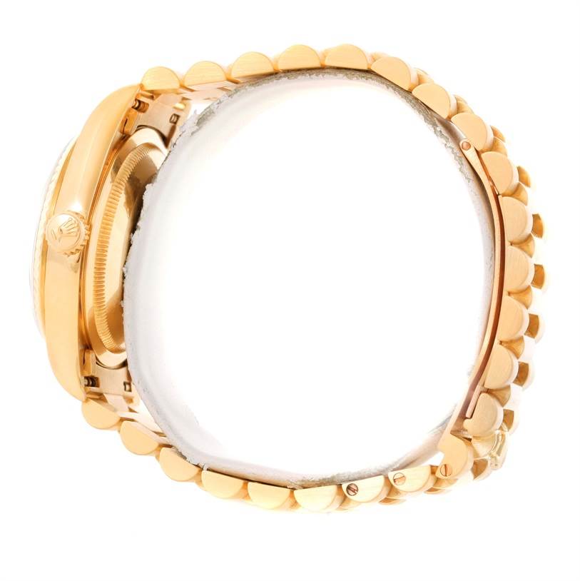 This image shows a side view of the Rolex President 18238 Men
s Yellow Gold Champagne Dial 18238 Men
s Yellow Gold Champagne Dial model watch, focusing on the crown and bracelet links.