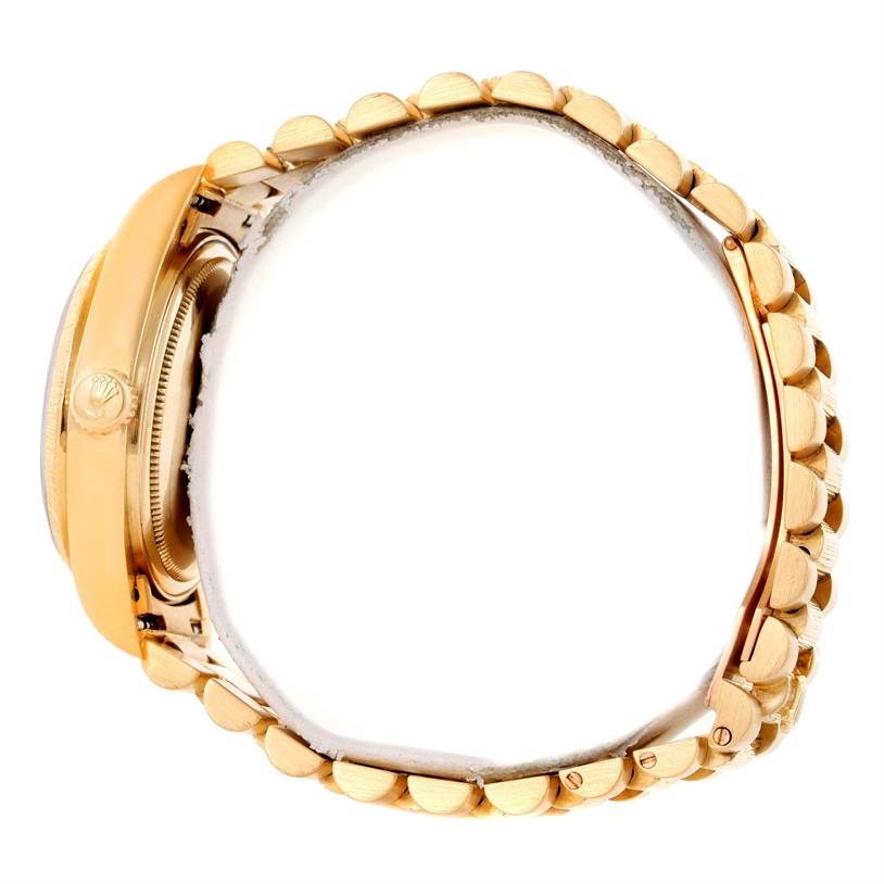 This image shows a side view of the Rolex President 18078 Yellow Gold Champagne Dial 18078 Yellow Gold Champagne Dial model watch, focusing on its crown and bracelet.