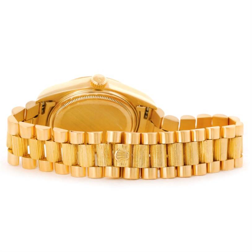 The image shows the underside and bracelet of a Rolex President 18078 Yellow Gold Champagne Dial 18078 Yellow Gold Champagne Dial model watch, highlighting its gold finish and clasp.