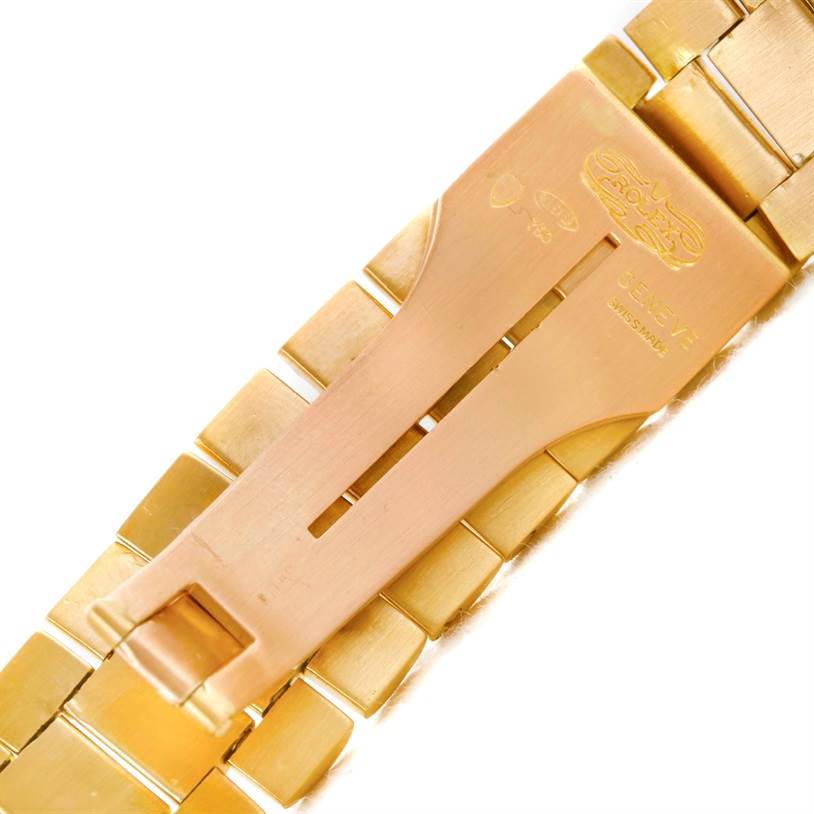 The image shows the clasp mechanism of a gold Rolex President Men's  Men's  model watch, viewed from the back.