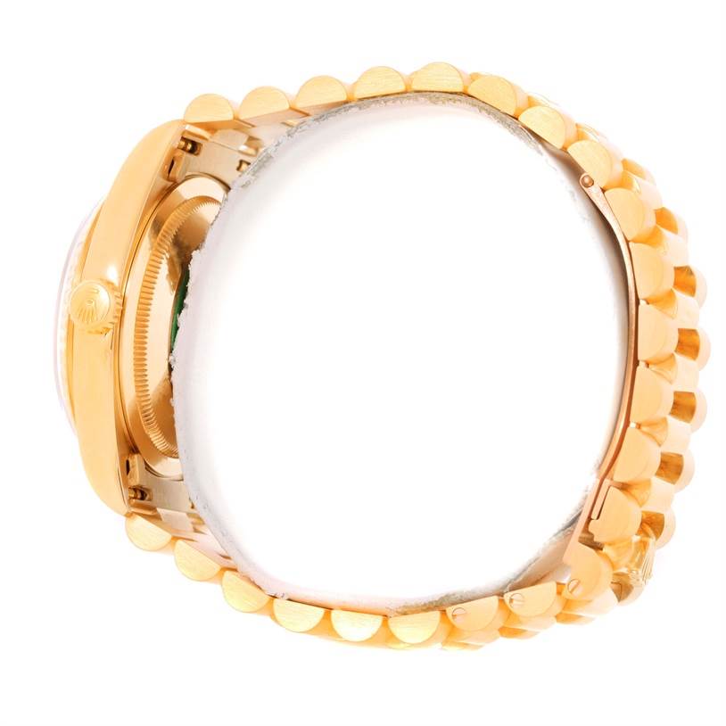 This image shows a side view of the Rolex President 18238 Men
s Yellow Gold Champagne Dial 18238 Men
s Yellow Gold Champagne Dial model watch, highlighting its gold case and bracelet band.