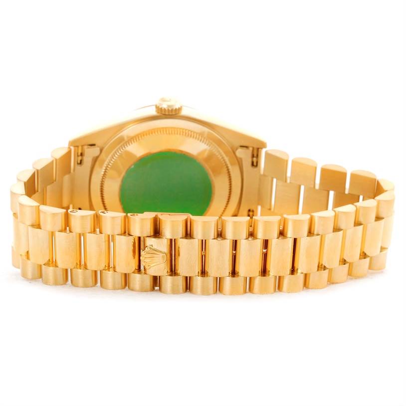 The image shows the back view of the Rolex President 18238 Men
s Yellow Gold Champagne Dial 18238 Men
s Yellow Gold Champagne Dial model watch with its gold bracelet and case back visible.