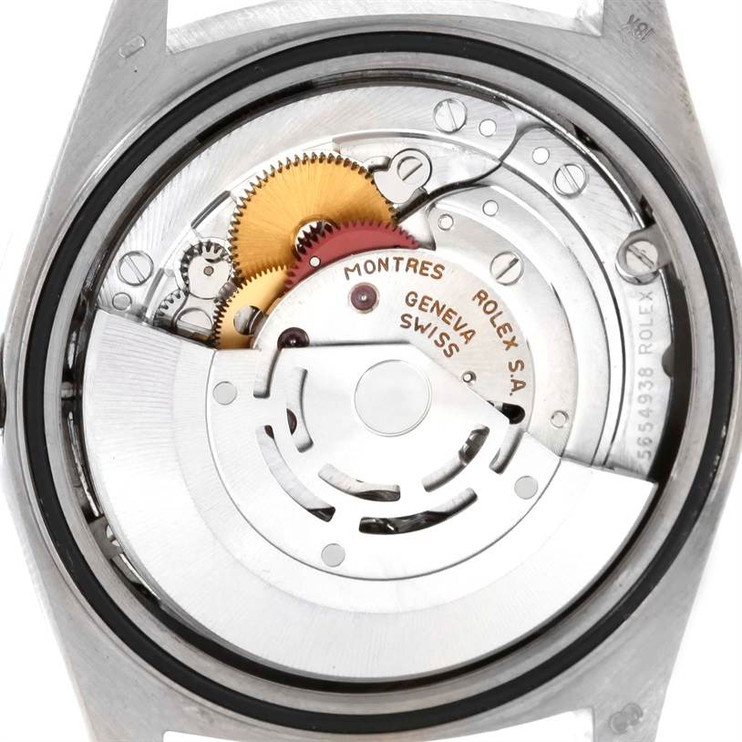 This is an inside view of the movement mechanism in a Rolex President 18239 Men
s White Gold Silver Dial 18239 Men
s White Gold Silver Dial model watch, showcasing gears and components.