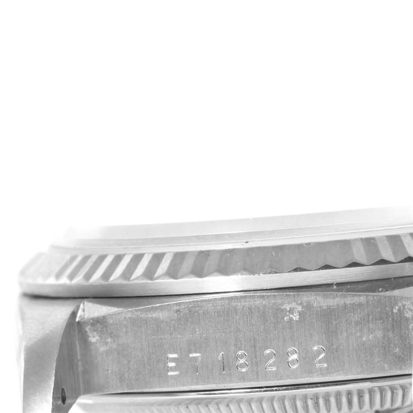 The image shows a close-up of the side case and bezel of a Rolex President 18239 Men
s White Gold Silver Dial 18239 Men
s White Gold Silver Dial model watch, featuring its serial number.