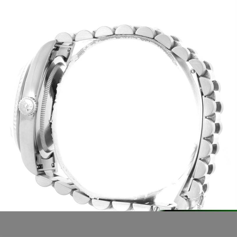 Side view of the Rolex President 18239 Men
s White Gold Silver Dial 18239 Men
s White Gold Silver Dial model watch showing the crown, case, and bracelet link.