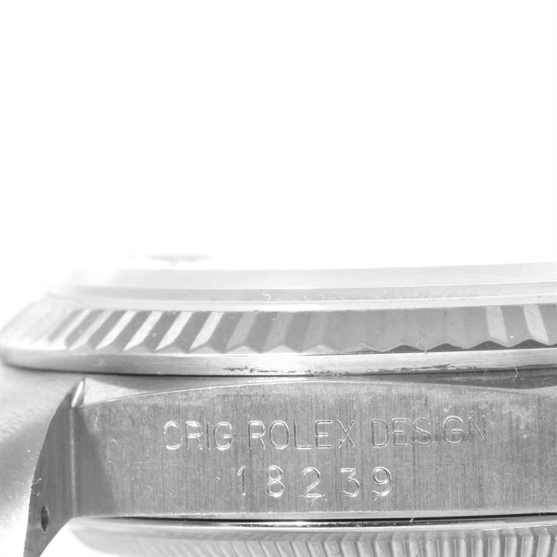 The image shows a close-up side view of a Rolex President 18239 Men
s White Gold Silver Dial 18239 Men
s White Gold Silver Dial model watch, highlighting the bezel and engraved case side with the model number.