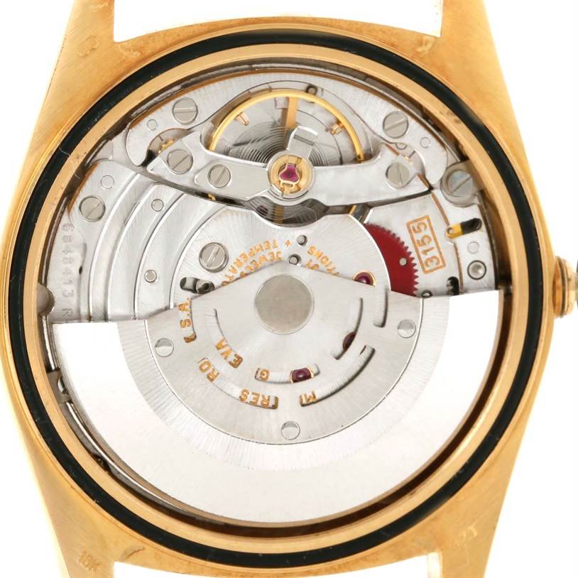 The image displays the open back of a Rolex President 18238 Men's Yellow Gold White Dial 18238 Men's Yellow Gold White Dial model, showcasing the internal movement components.
