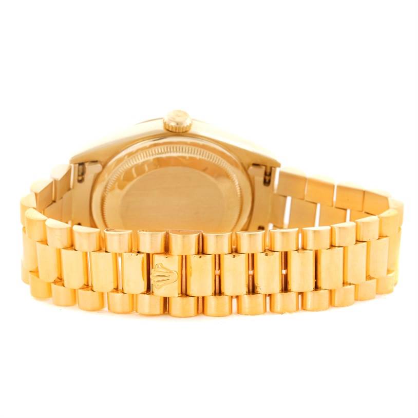 The image shows the back of the Rolex President 18238 Men's Yellow Gold White Dial 18238 Men's Yellow Gold White Dial model watch, highlighting the case back and the bracelet.